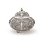 AN INDIAN SILVER PIERCED LOBED CIRCULAR BOX